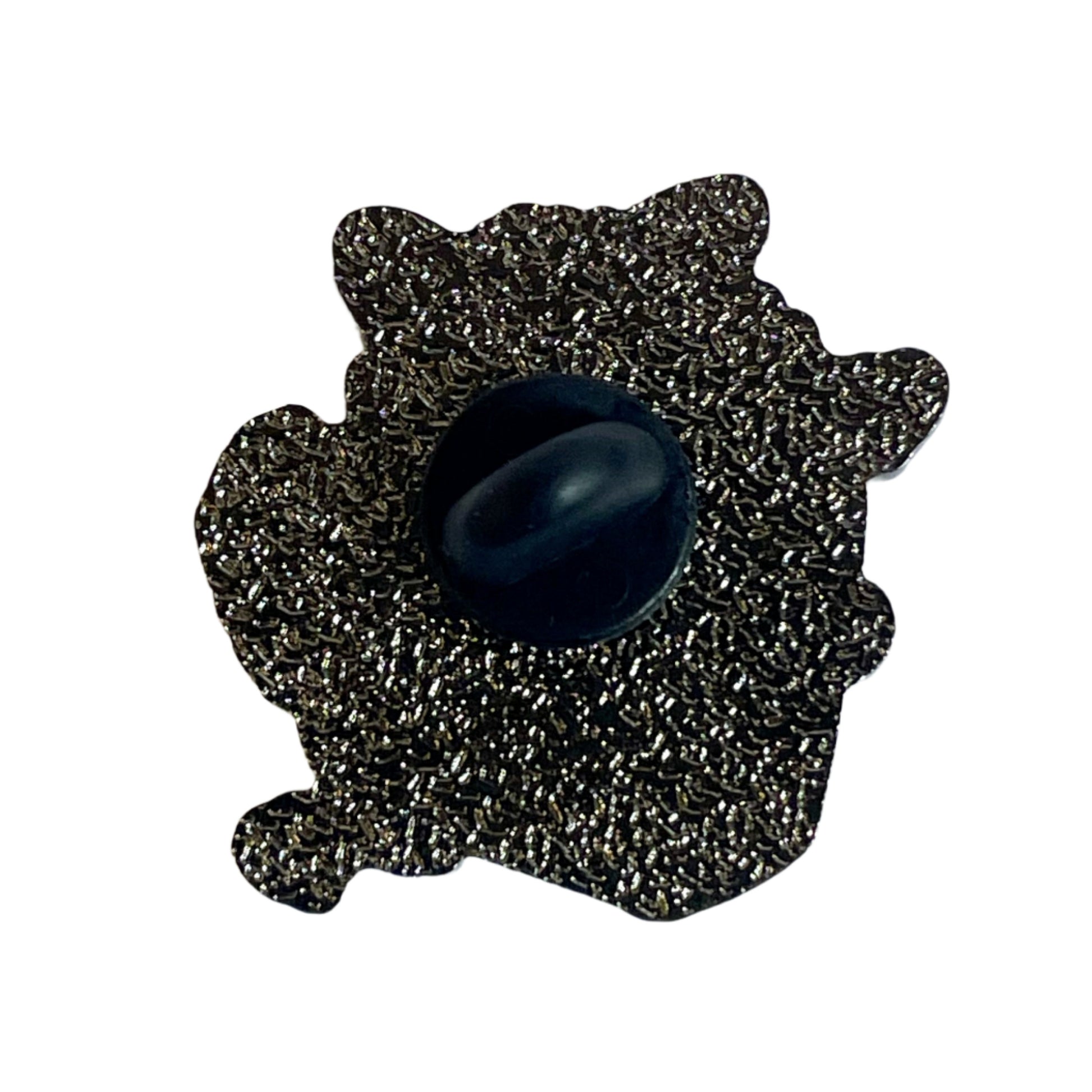 back of the raccoon pin, featuring metal plating and a plastic safety backing